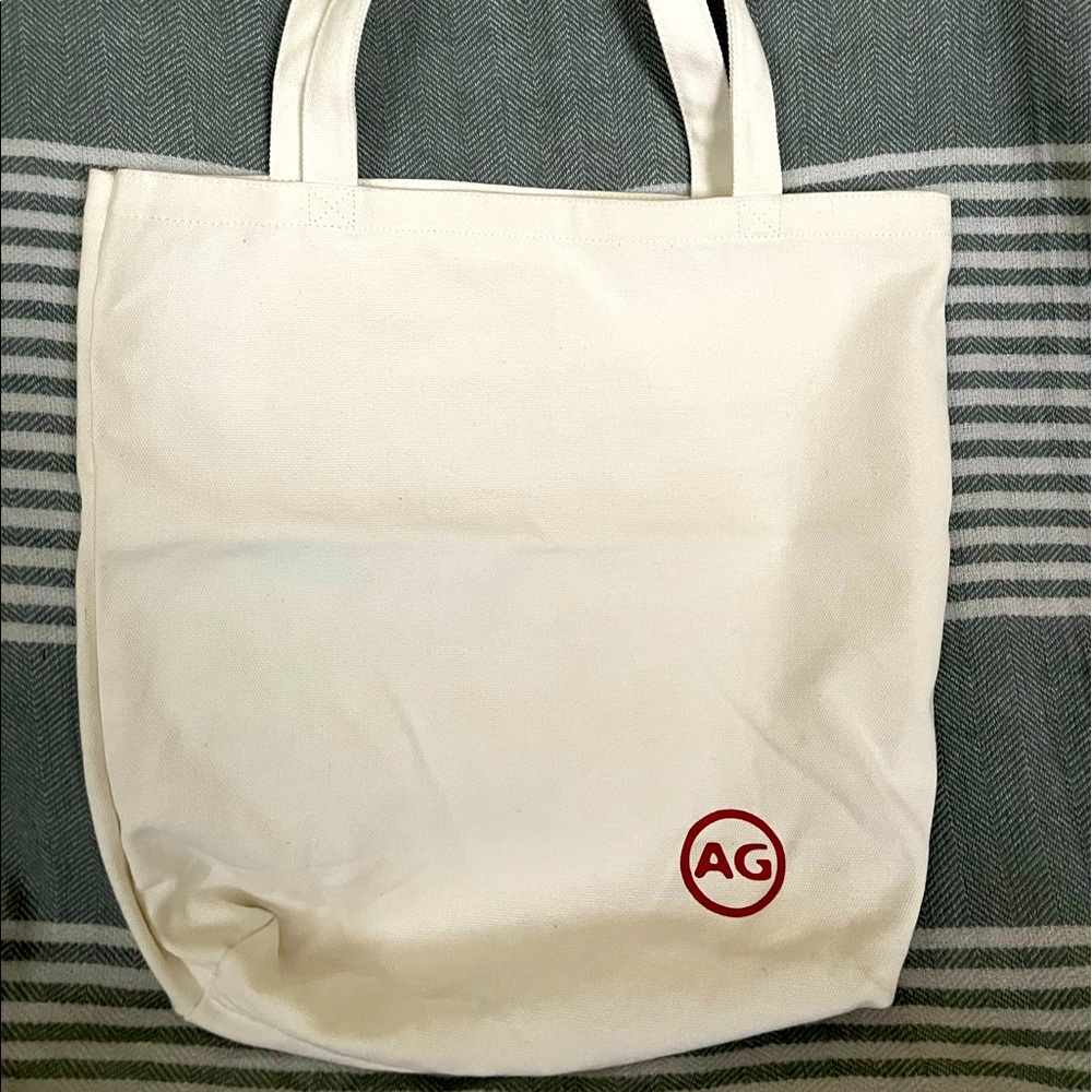 AG Adriano Gildschmied white canvas tote.‎